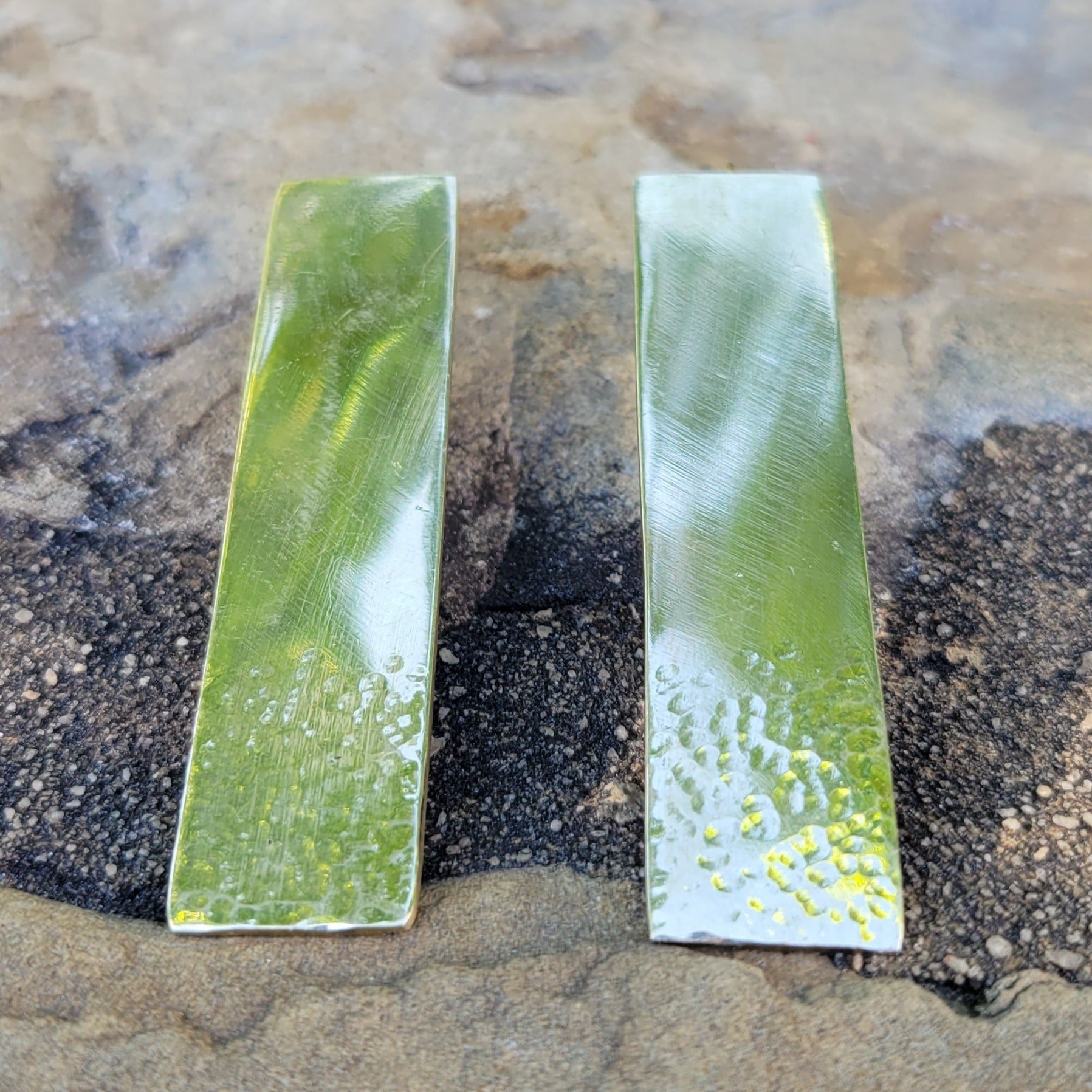An image of gold-color Elongated hammered rectangles on threader wires. Shop Kamawe