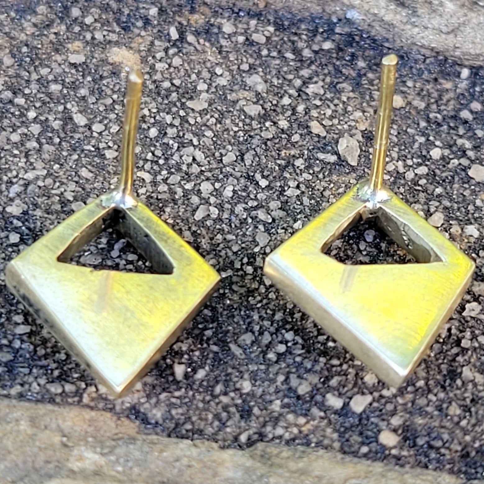 An image of gold-color Lightweight open-diamond studs in polished brass. Shop Kamawe