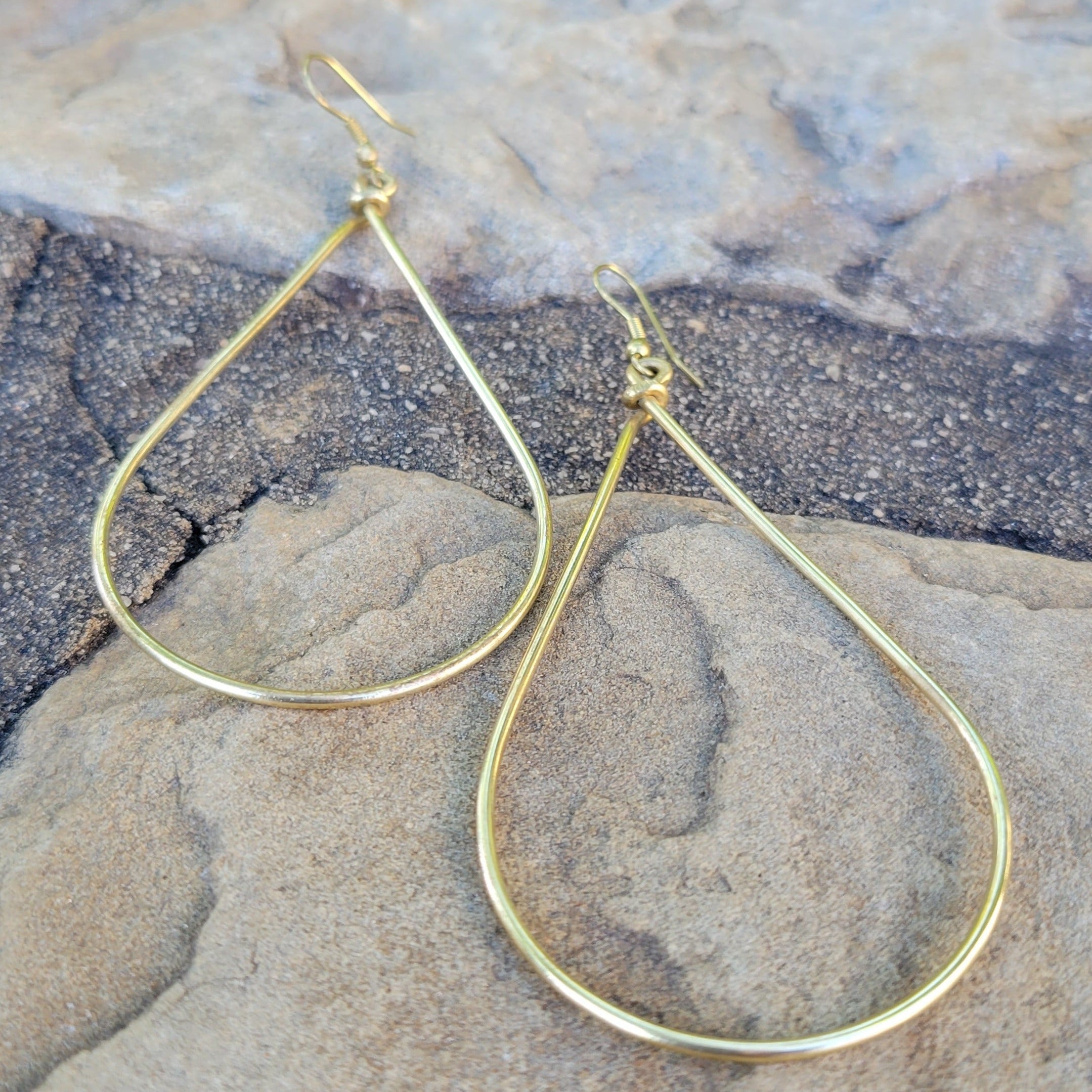 An image of gold-color Classic teardrop-shaped brass drop earrings. Shop Kamawe