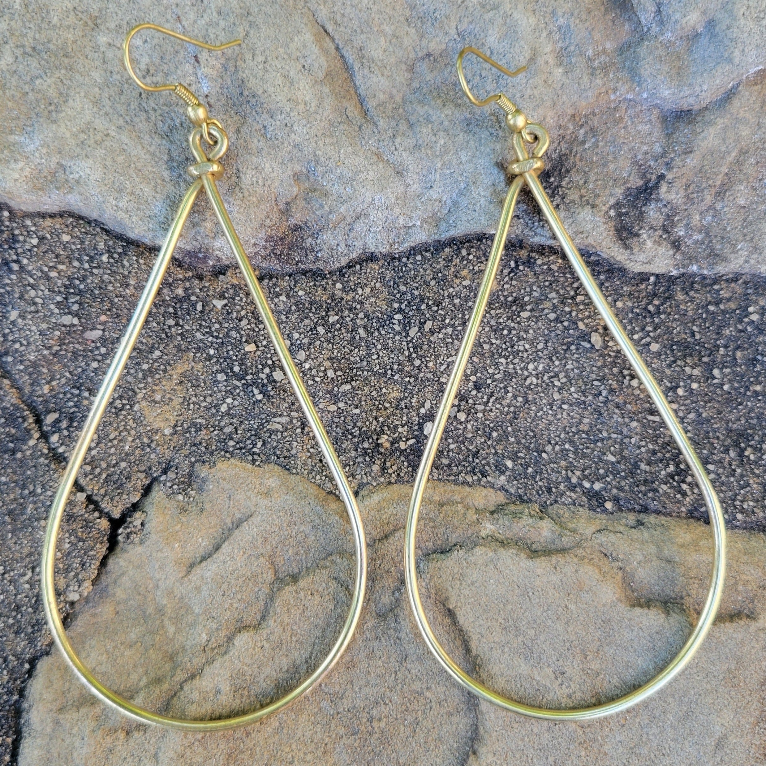 An image of gold-color Classic teardrop-shaped brass drop earrings. Shop Kamawe