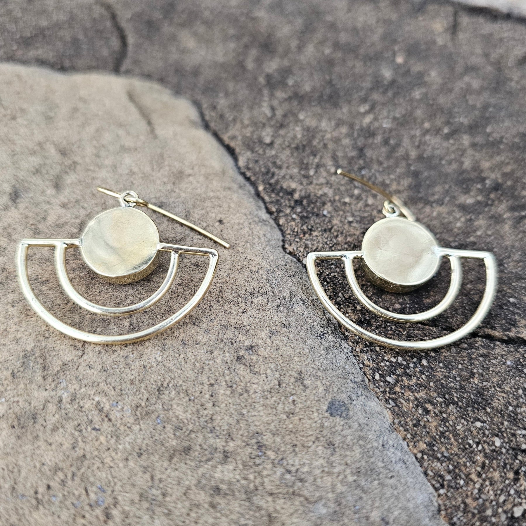 An image of gold & black-color Sleek crescent brass earrings with shadowed finish. Shop Kamawe