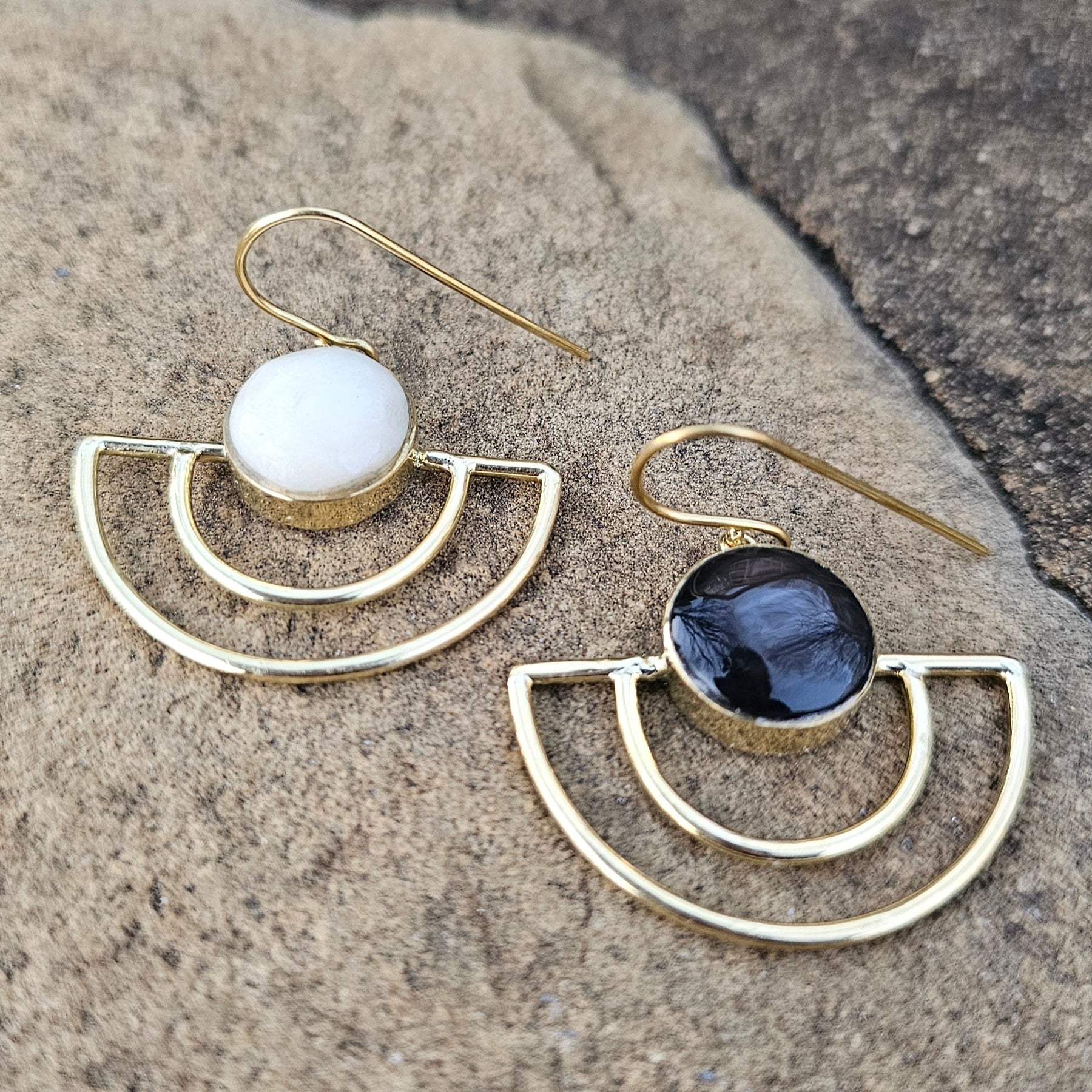 An image of gold & black-color Sleek crescent brass earrings with shadowed finish. Shop Kamawe