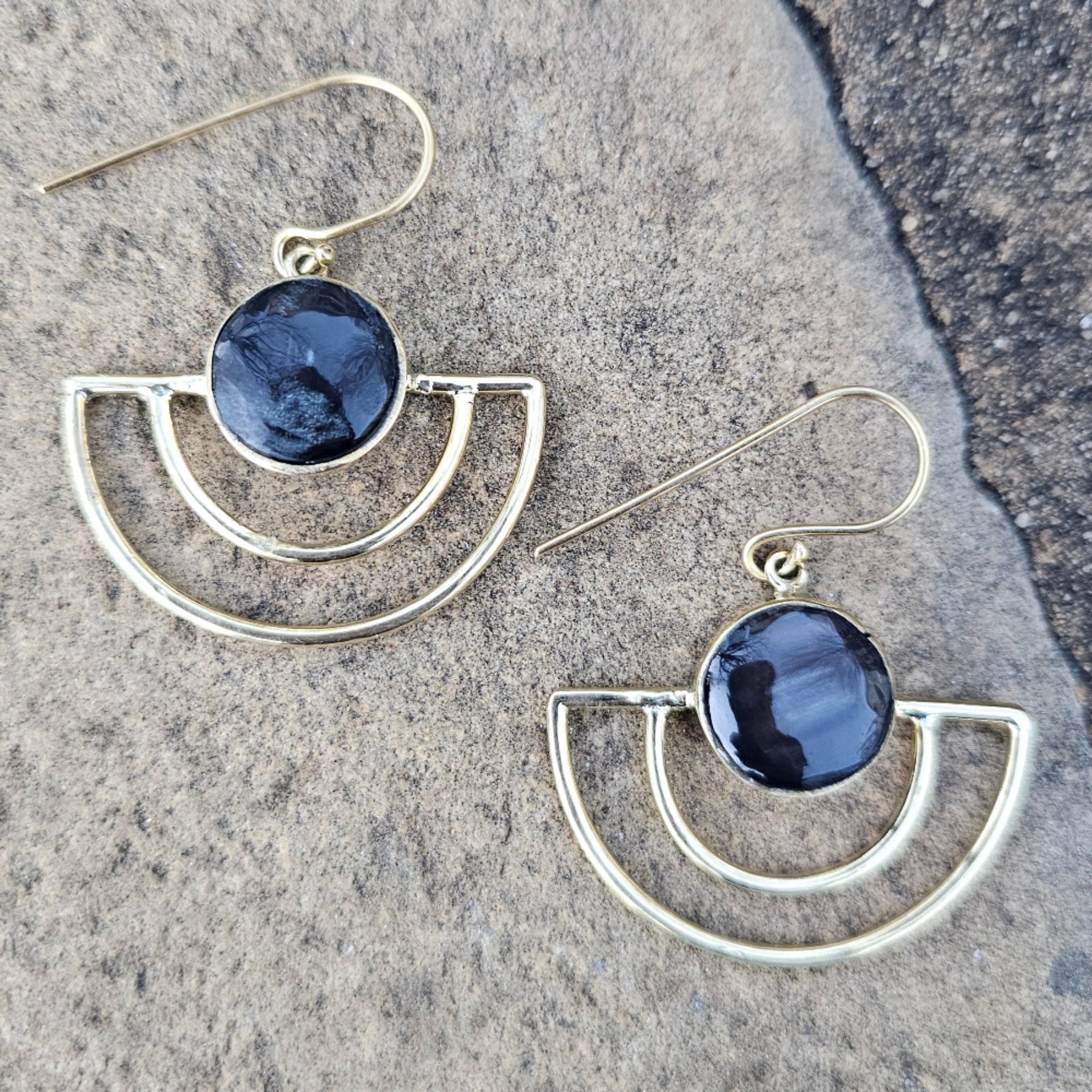An image of gold & black-color Sleek crescent brass earrings with shadowed finish. Shop Kamawe