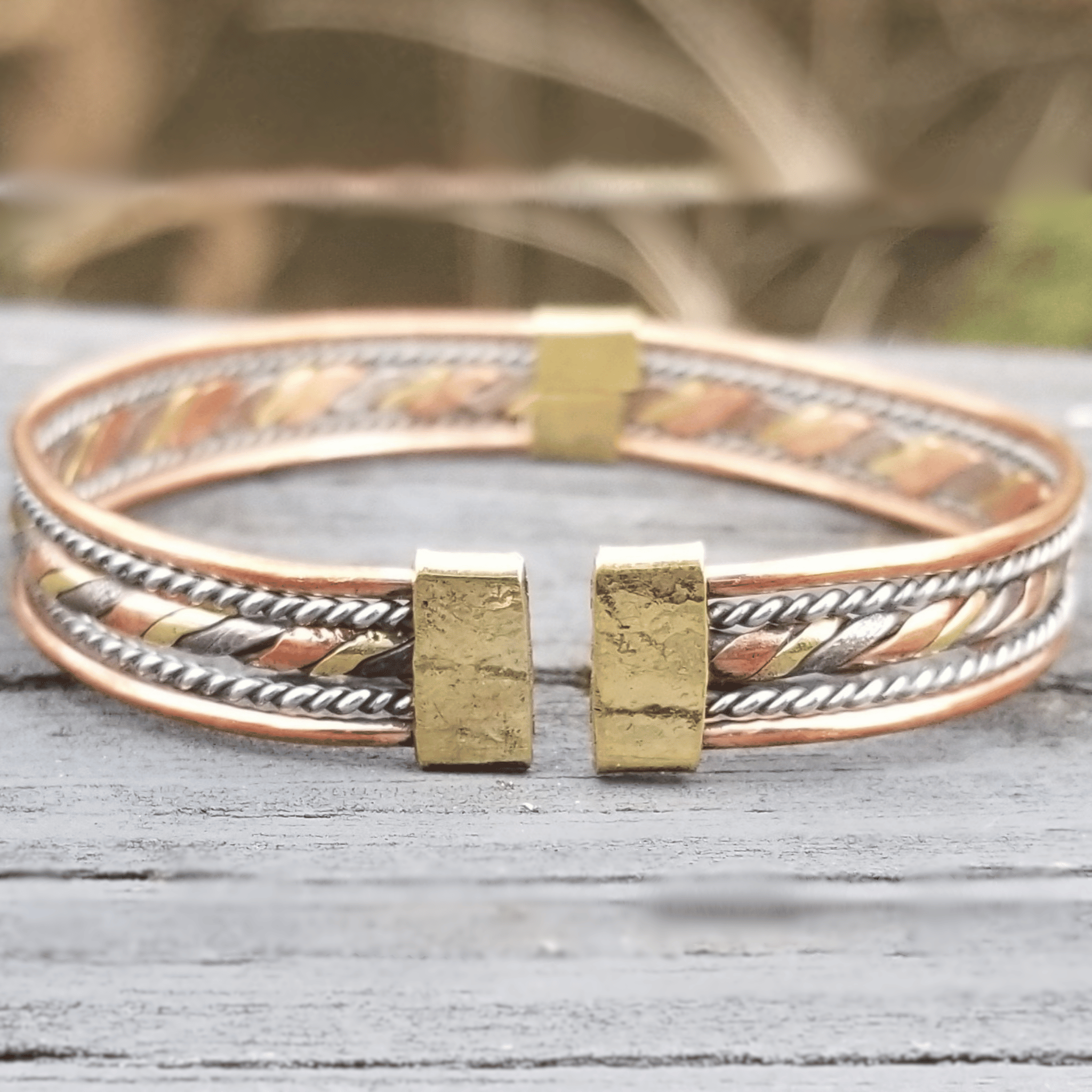 An image of Flattened twist combining different metallic tones. Shop Kamawe