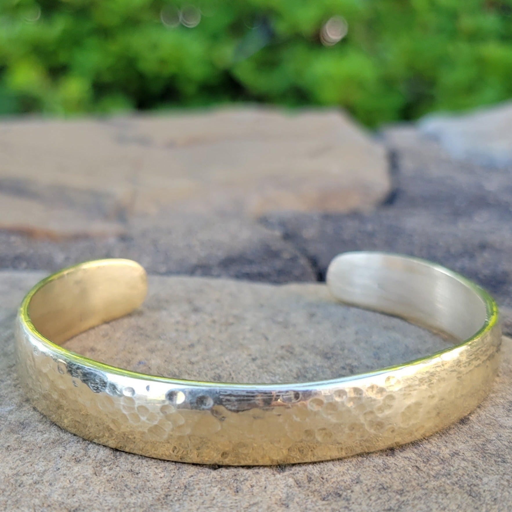 An image of Simple open cuff finished with organic hammer marks. Shop Kamawe