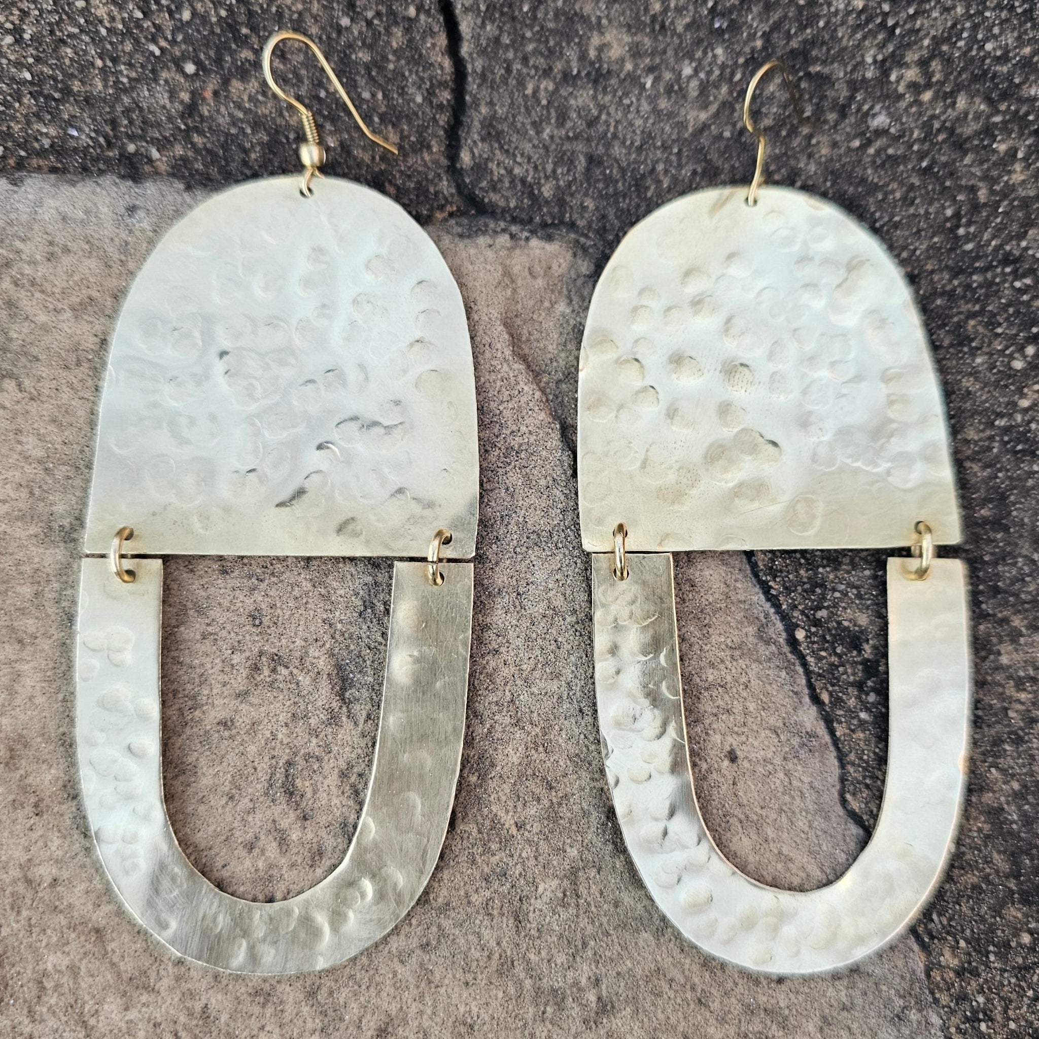 An image of gold-color Textured twin-U brass earrings with organic finish. Shop Kamawe