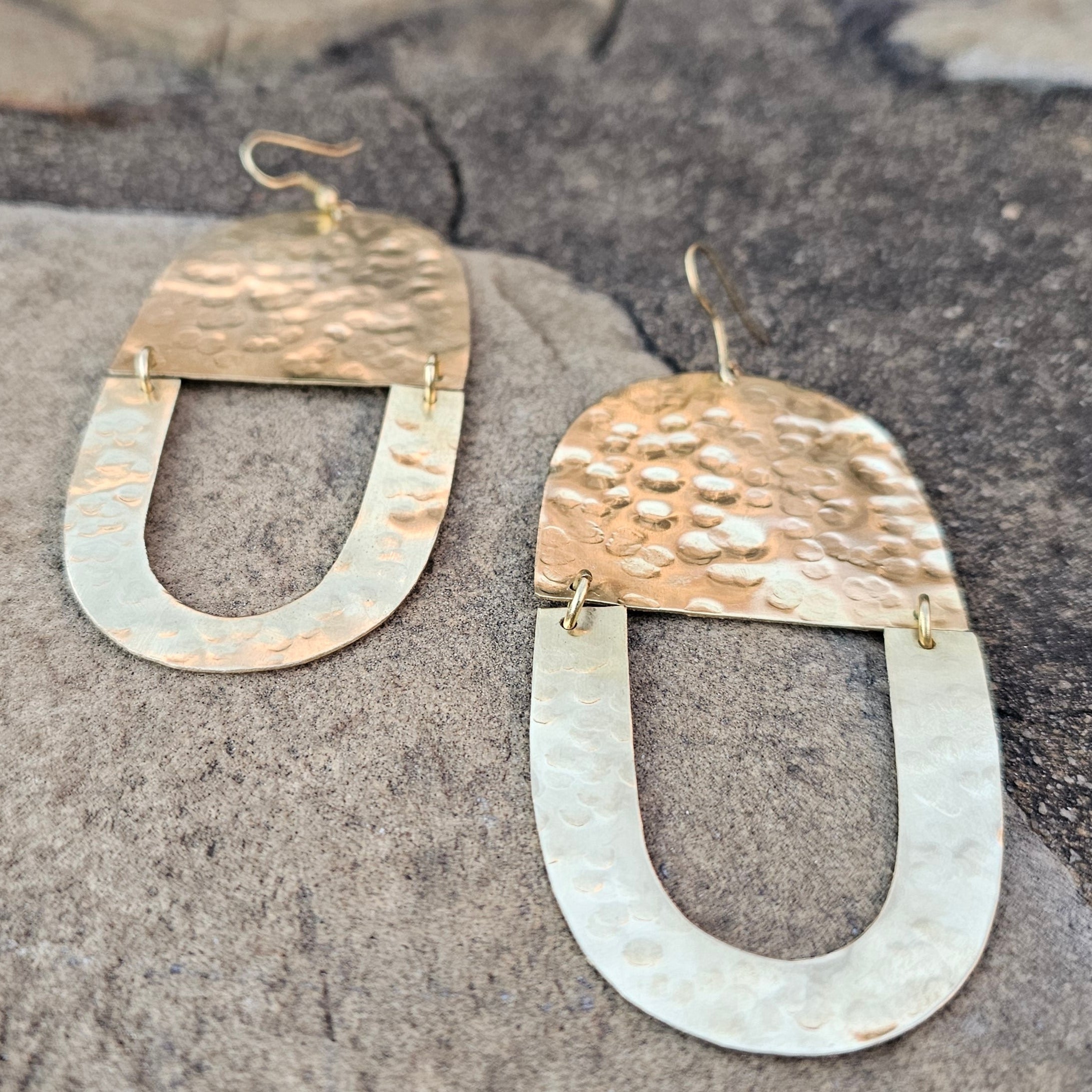 An image of gold-color Textured twin-U brass earrings with organic finish. Shop Kamawe