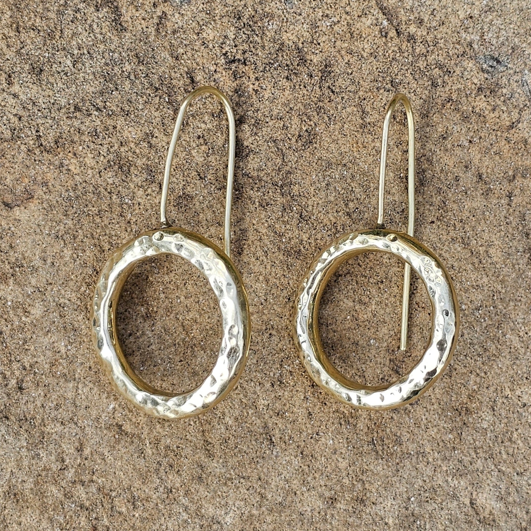 An image of gold-color Open halo brass rings with rustic finish. Shop Kamawe