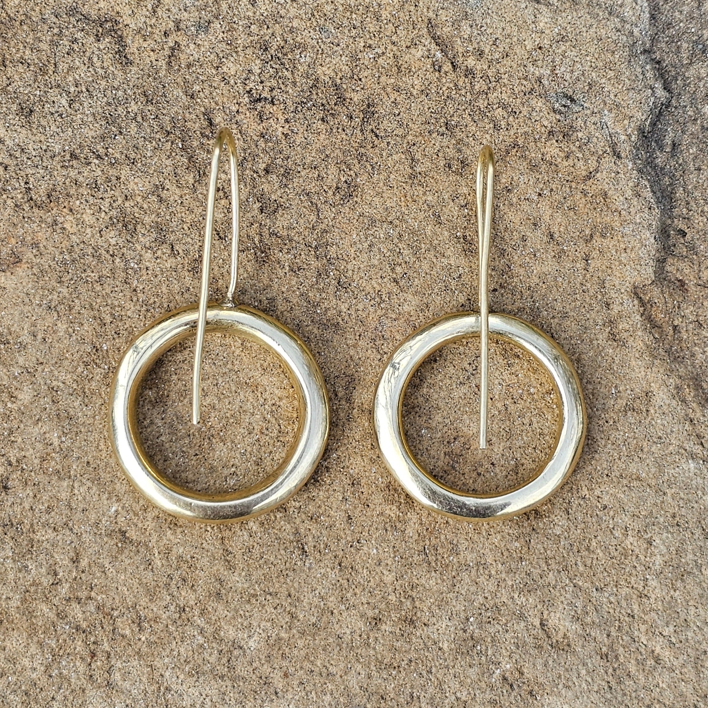 An image of gold-color Open halo brass rings with rustic finish. Shop Kamawe
