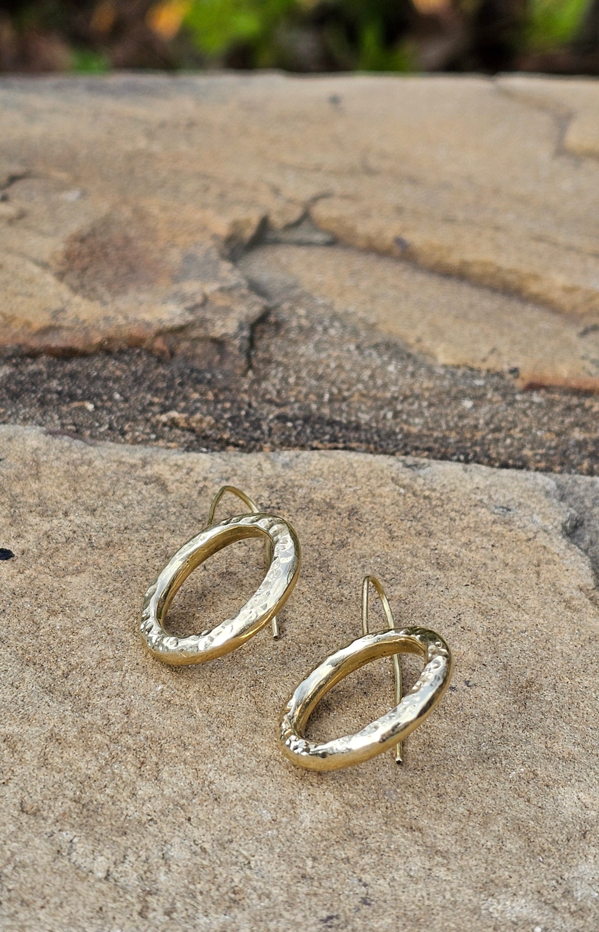 An image of gold-color Open halo brass rings with rustic finish. Shop Kamawe