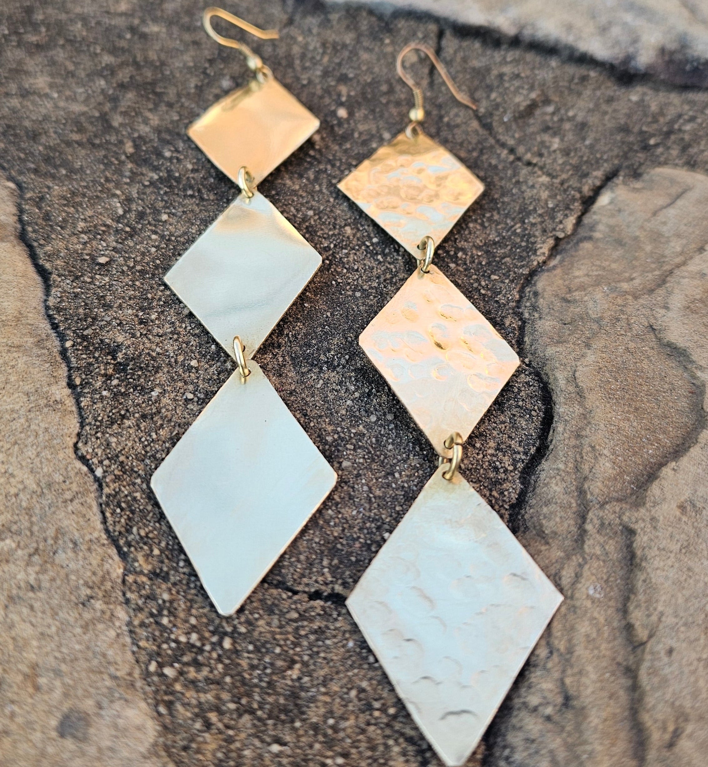 An image of gold-color Textured trio of diamond brass drops. Shop Kamawe