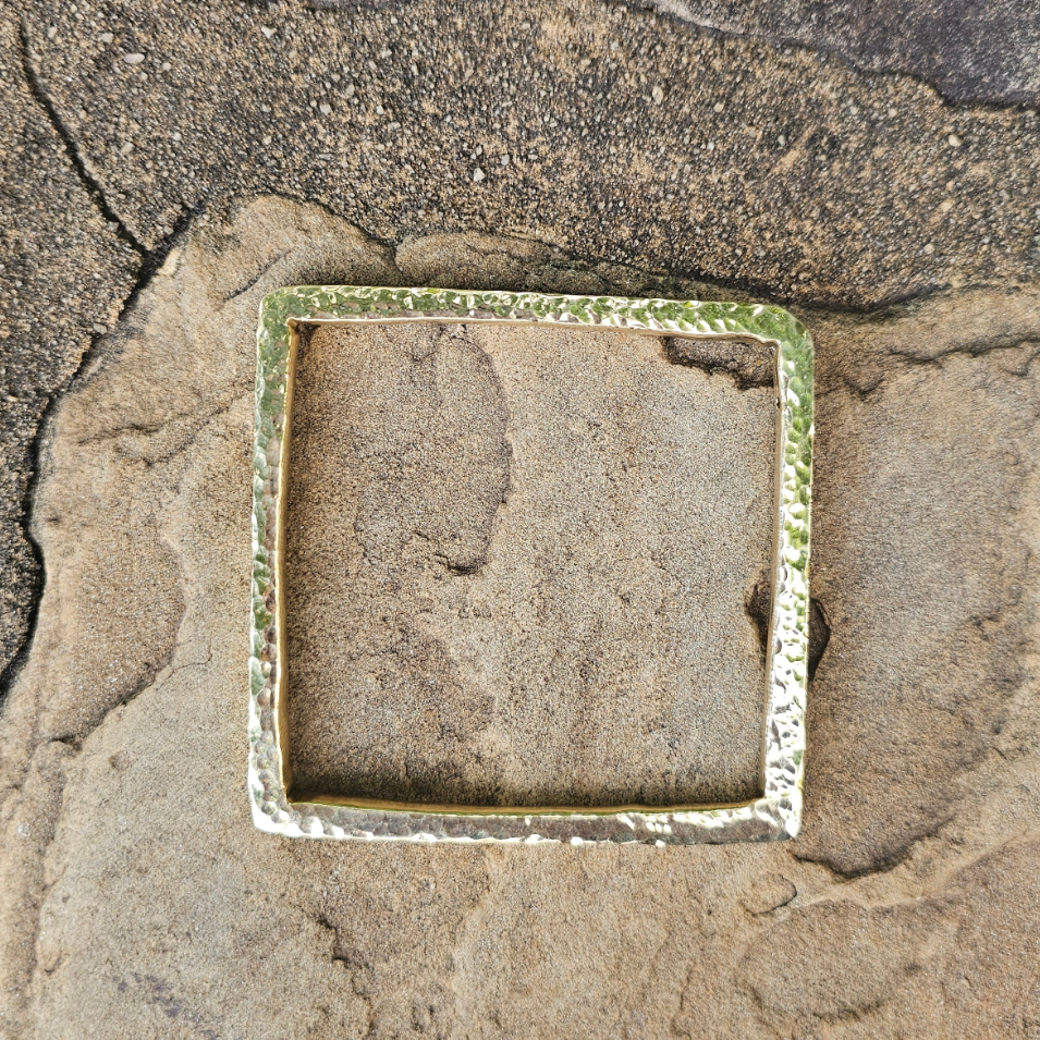 An image of gold-color Three-dimensional hammered cube brass bangle. Shop Kamawe
