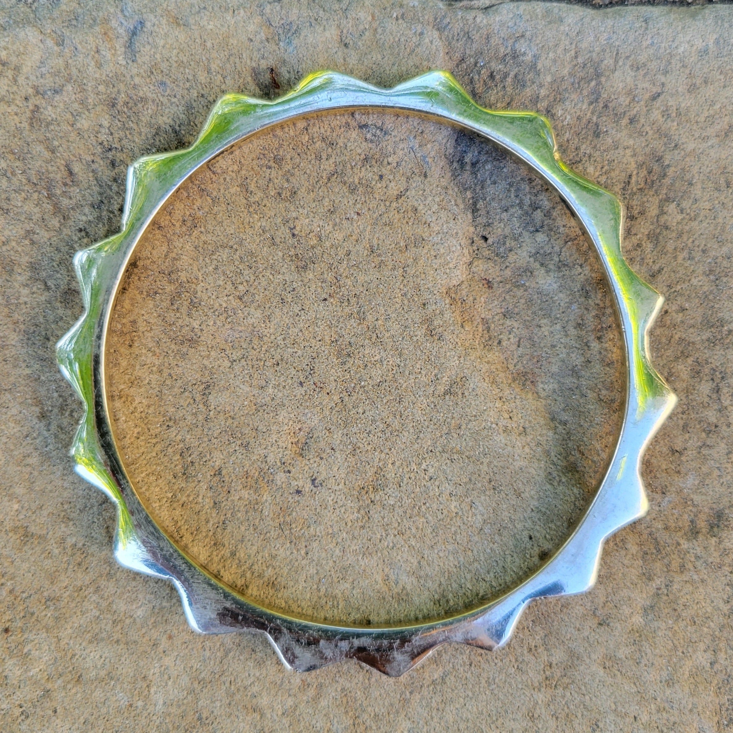 An image of Polished sunshine-motif brass bracelet. Shop Kamawe