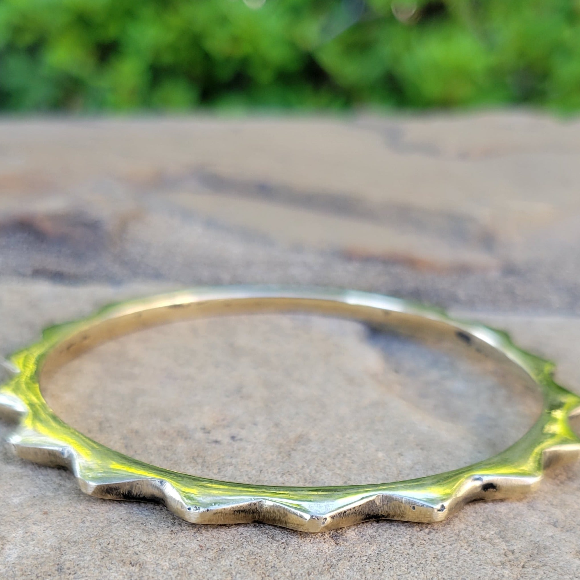An image of Polished sunshine-motif brass bracelet. Shop Kamawe