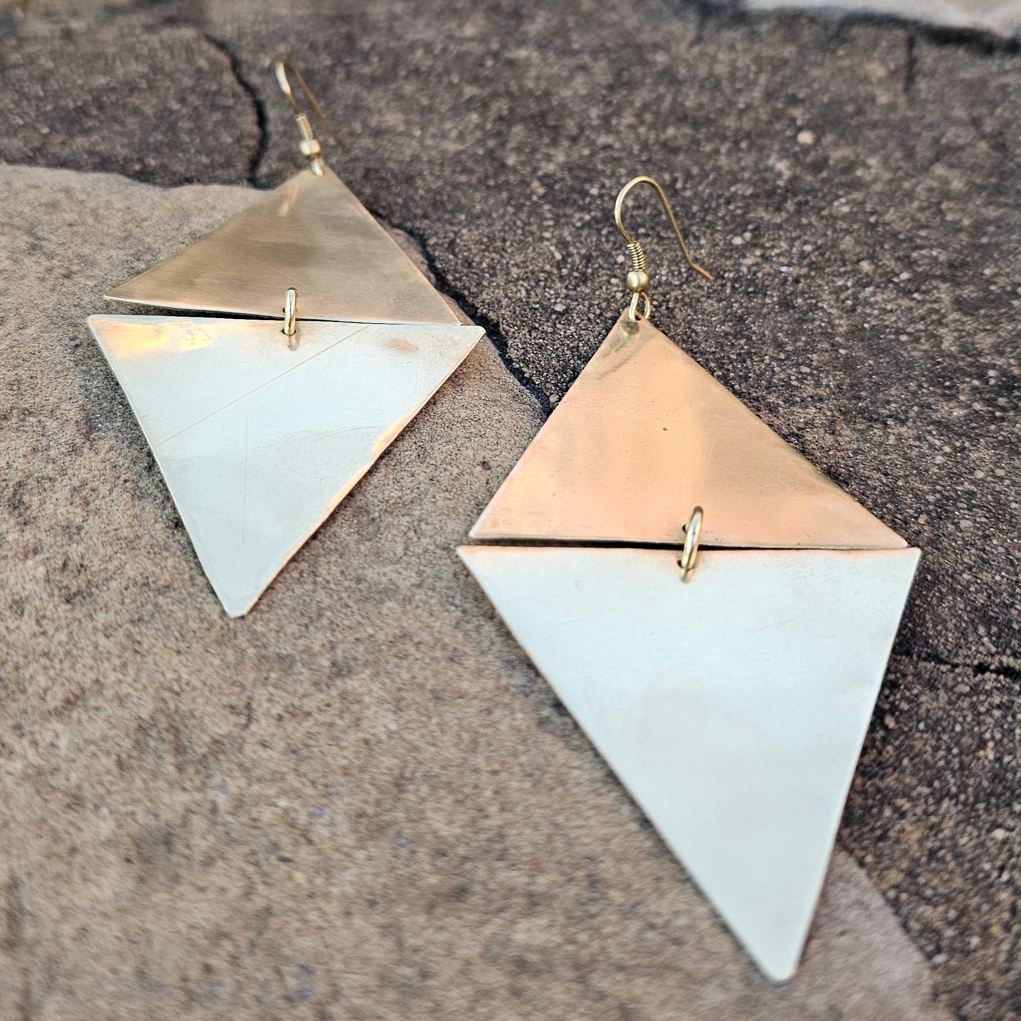 An image of gold-color Paired polished triangle brass earrings. Shop Kamawe