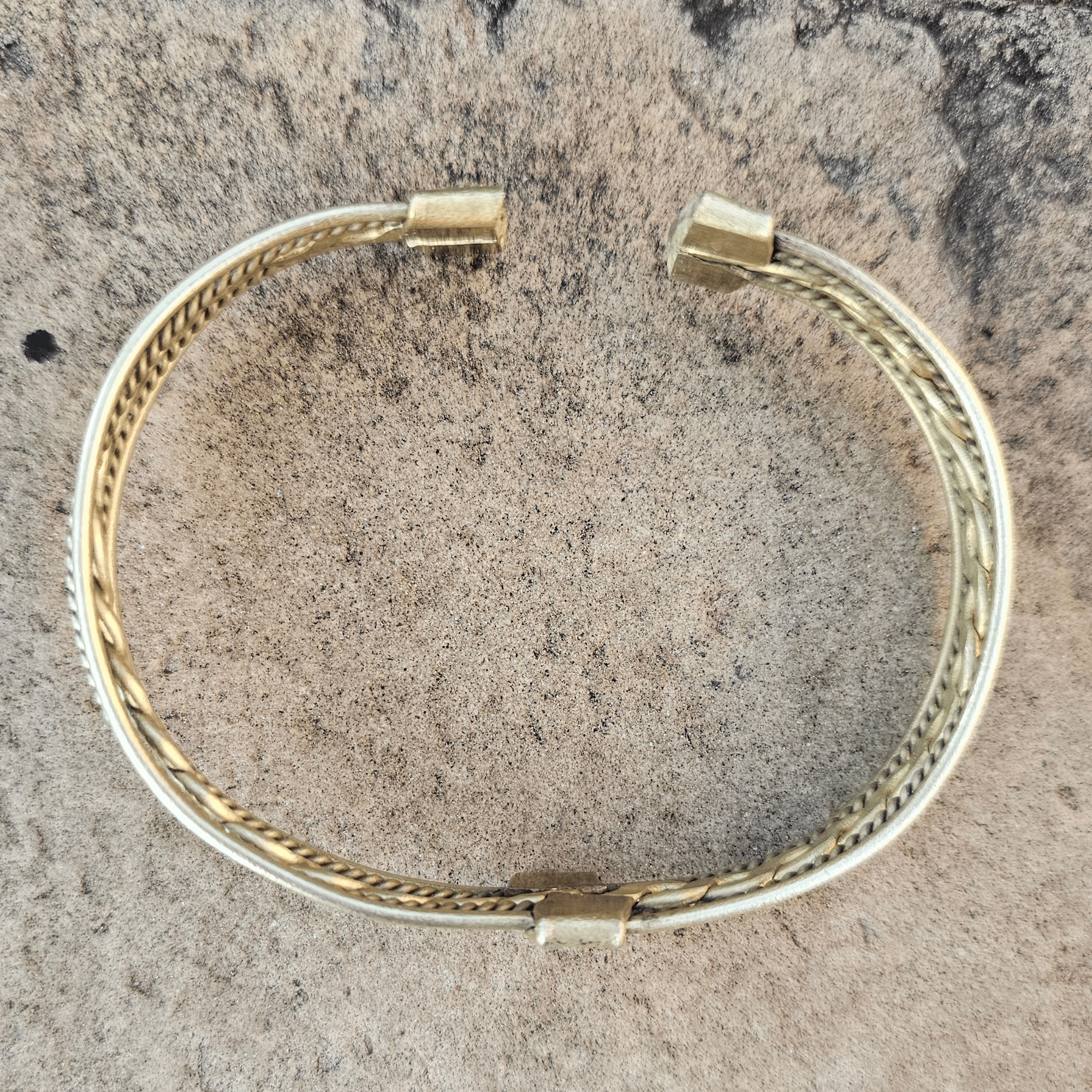 An image of gold-color Textured twisted brass bracelet with a bold, everyday unisex fit. Shop Kamawe