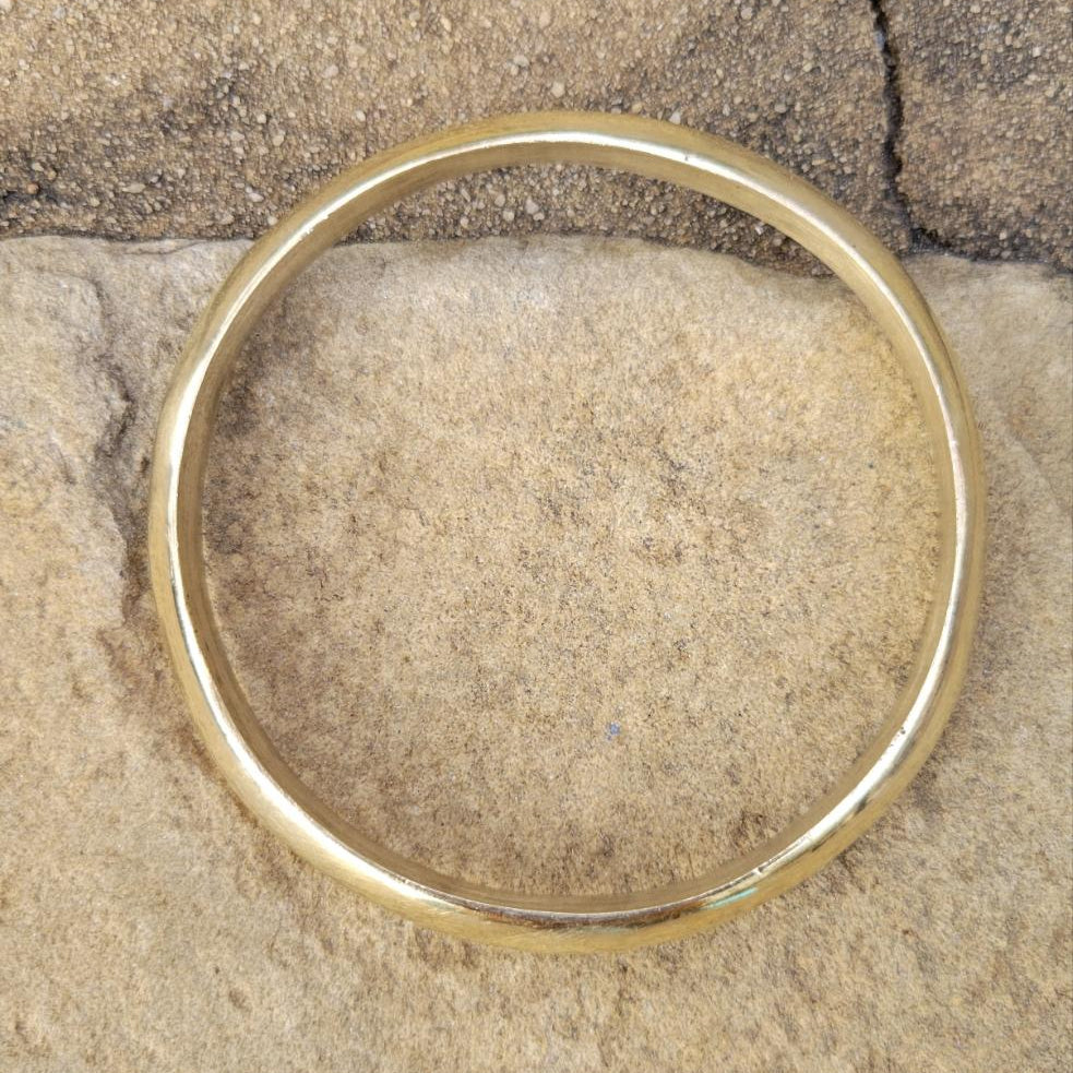 An image of Polished bangle with a gently lifted central ridge. Shop Kamawe