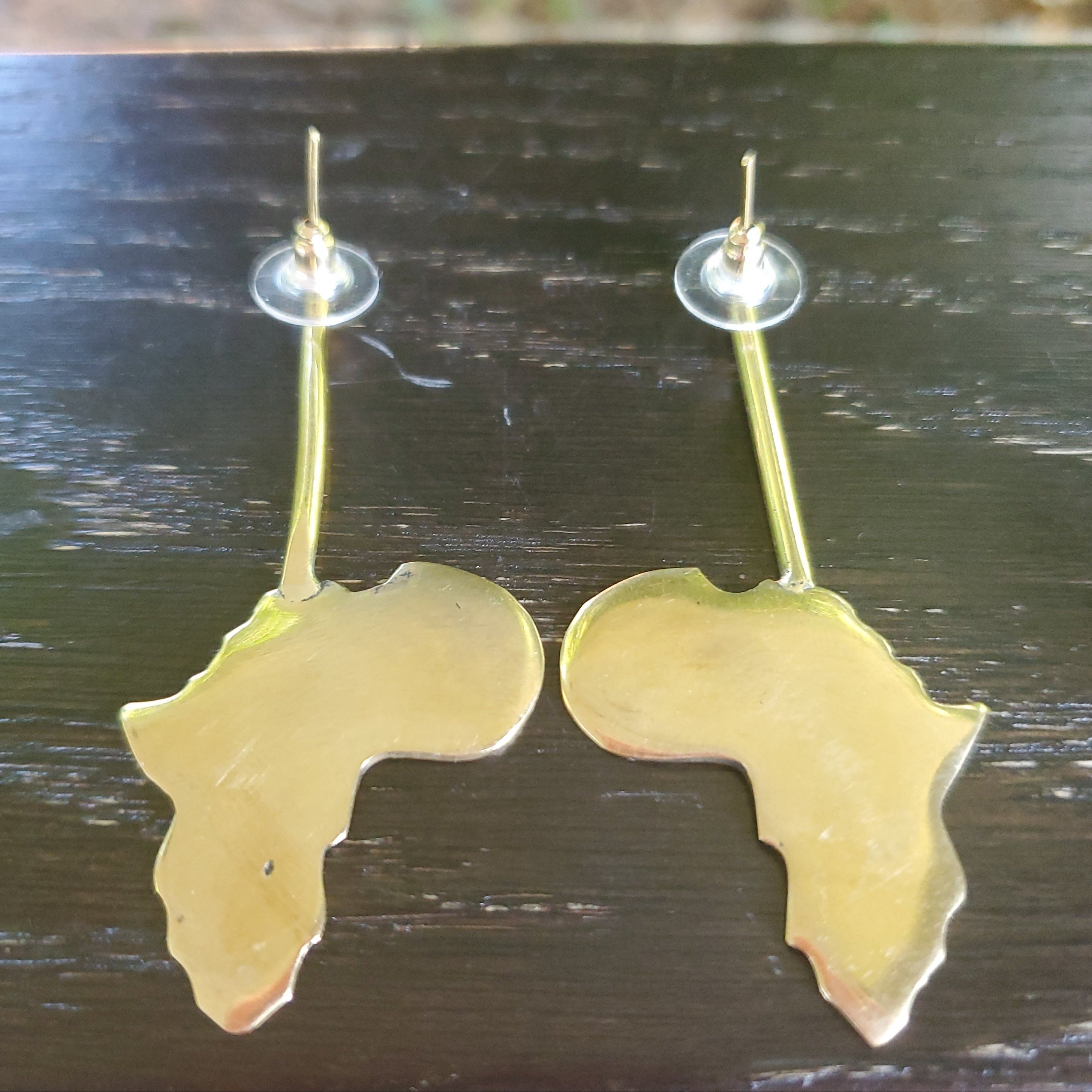 An image of gold-color Elongated Motherland outline in sleek brass form. Shop Kamawe