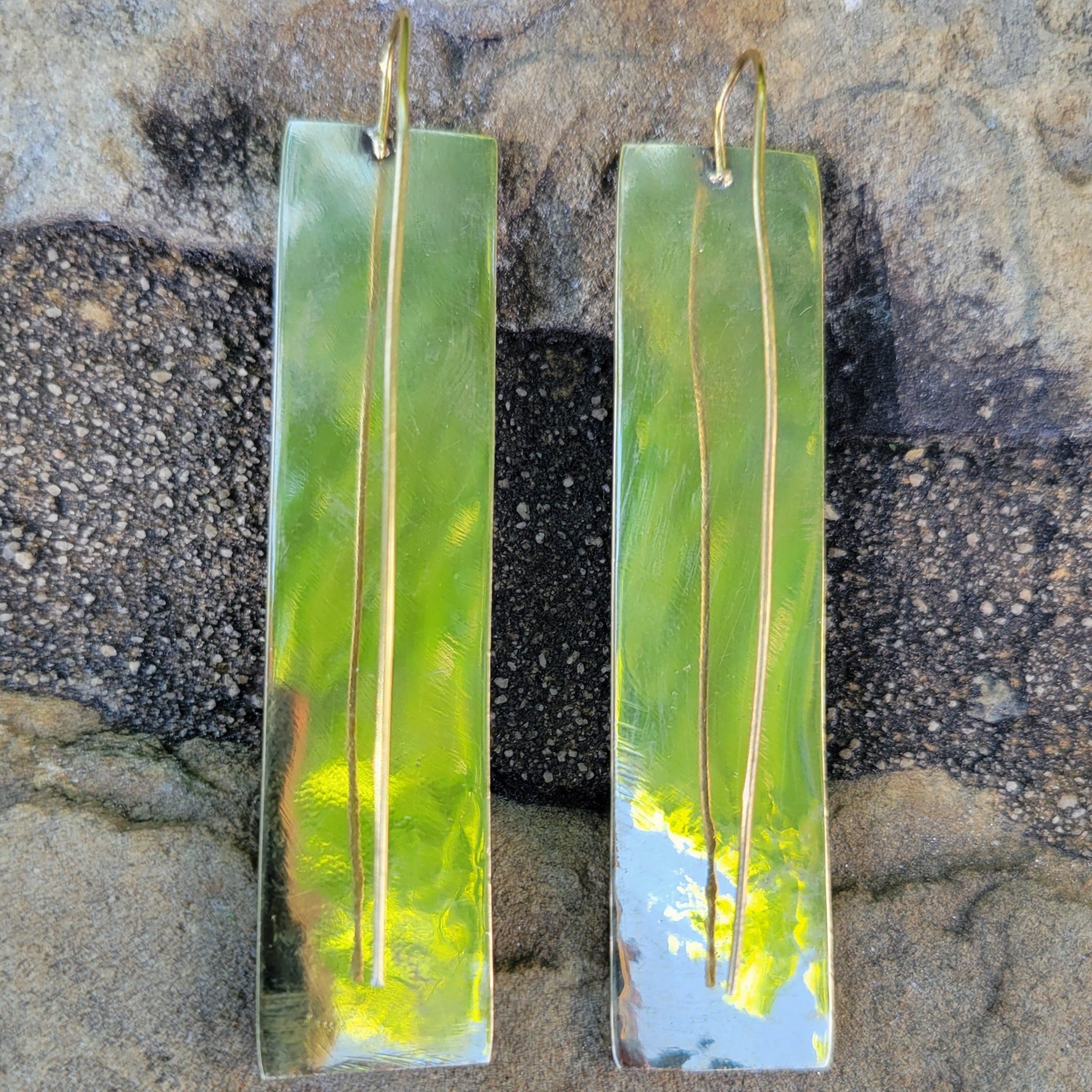 An image of gold-color Elongated hammered rectangles on threader wires. Shop Kamawe