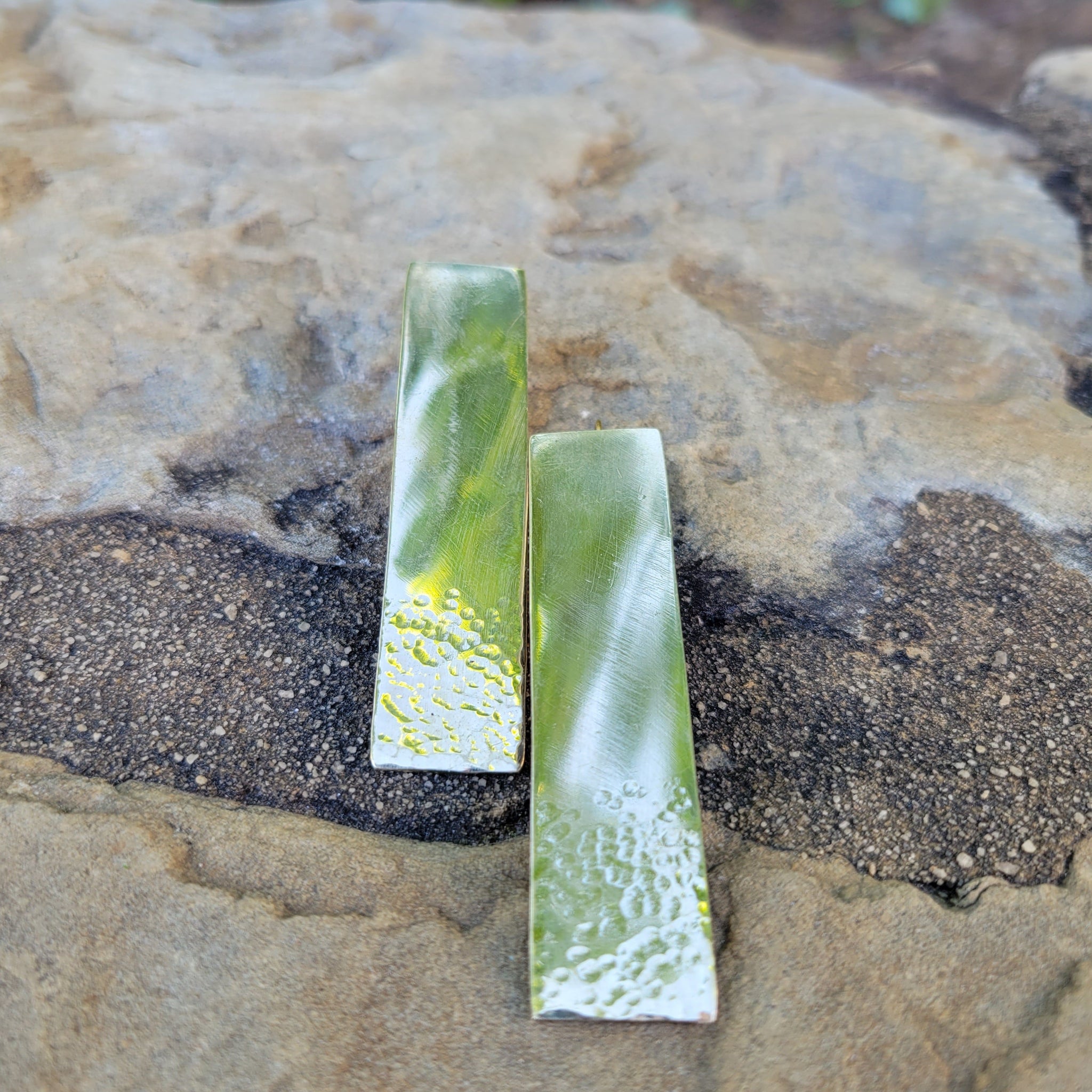 An image of gold-color Elongated hammered rectangles on threader wires. Shop Kamawe
