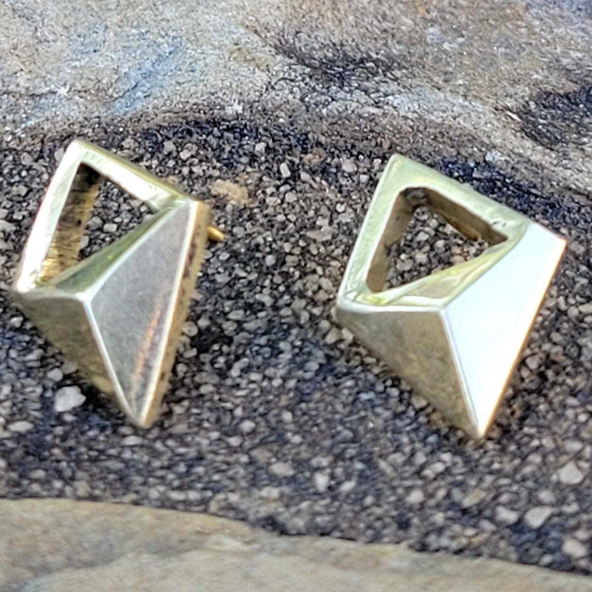 An image of gold-color Lightweight open-diamond studs in polished brass. Shop Kamawe