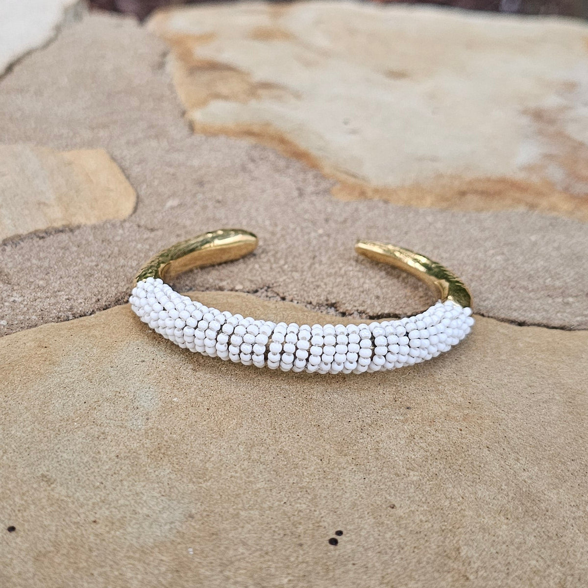 Hammered White Beaded Lion's Tooth Open Brass Bracelet
