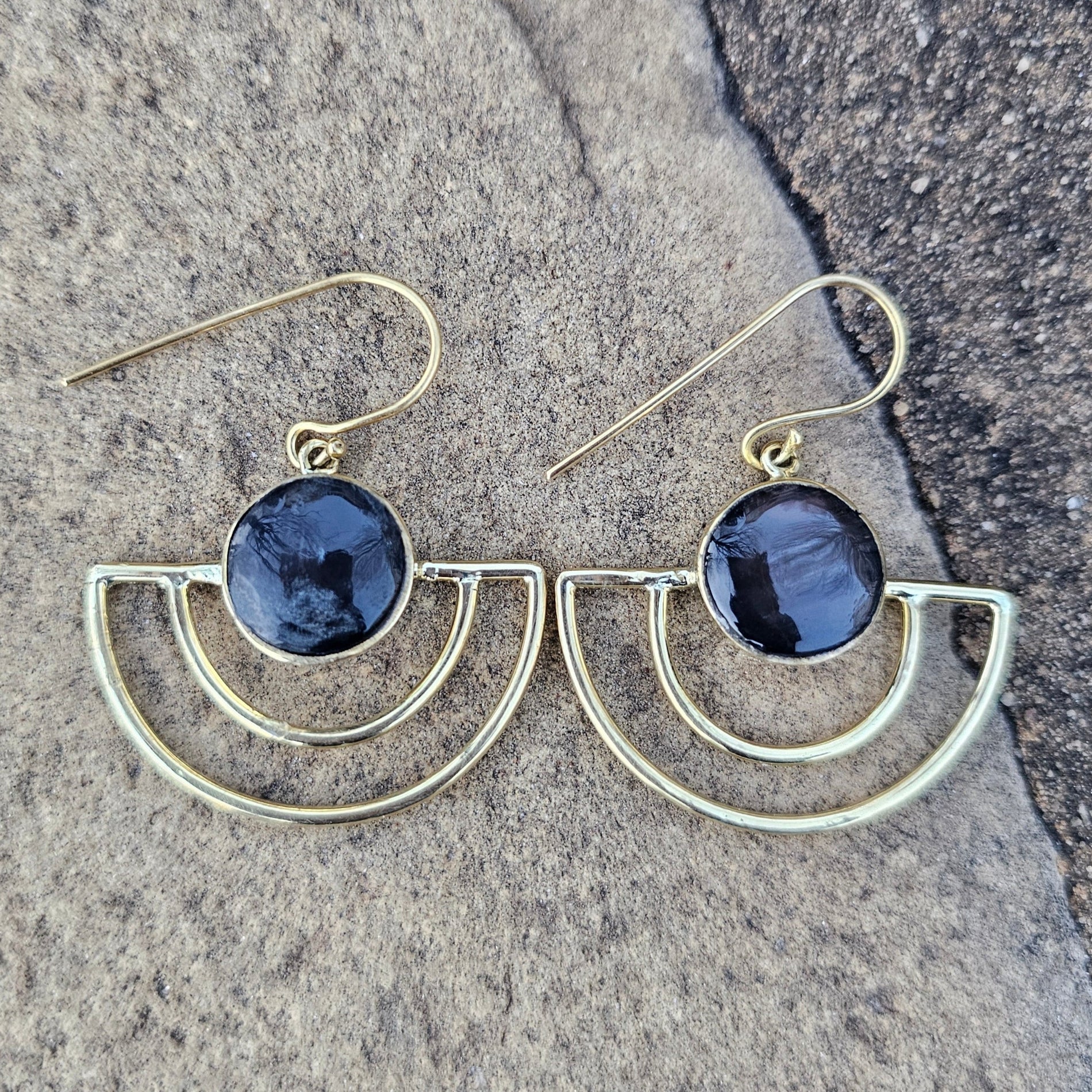An image of gold & black-color Sleek crescent brass earrings with shadowed finish. Shop Kamawe