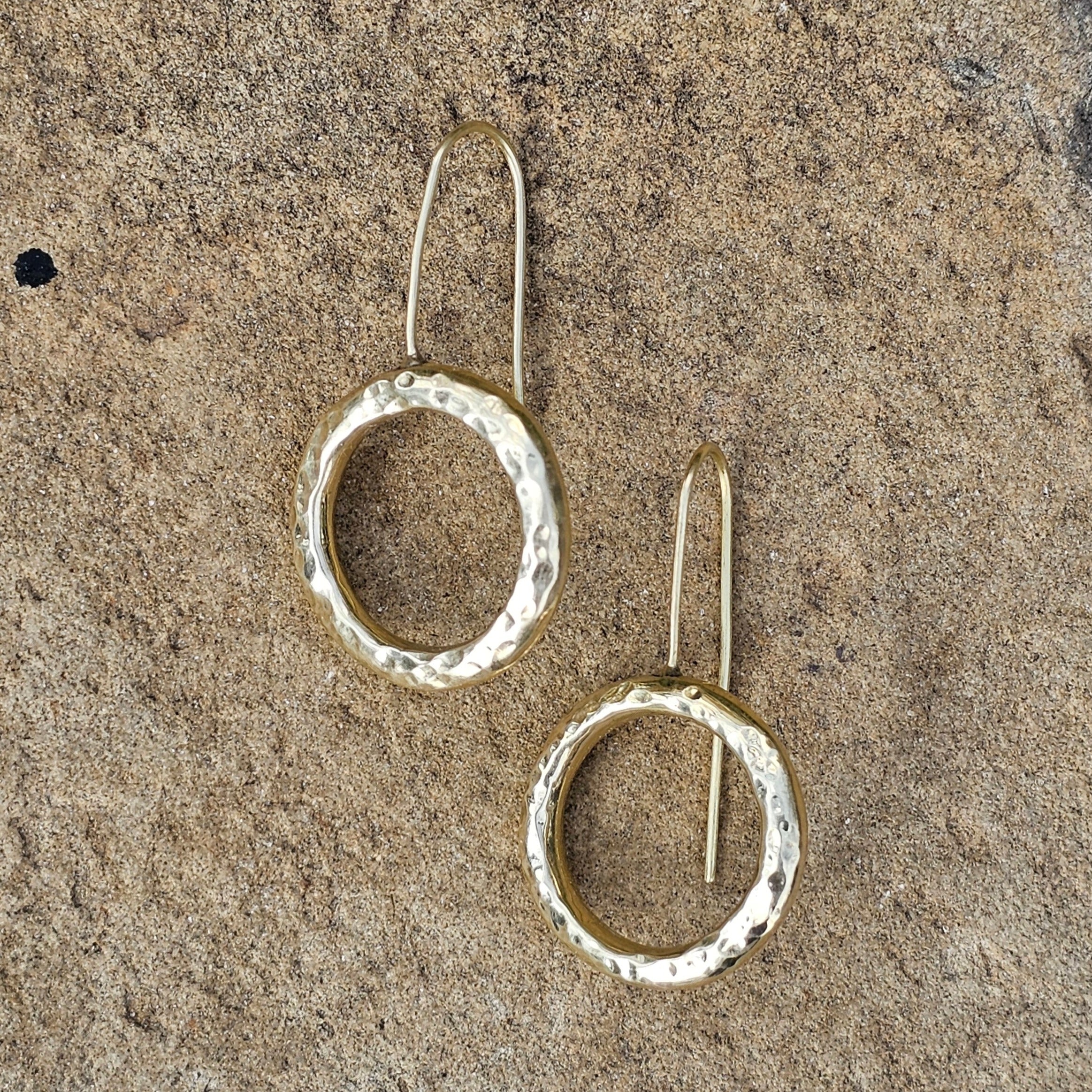 An image of gold-color Open halo brass rings with rustic finish. Shop Kamawe