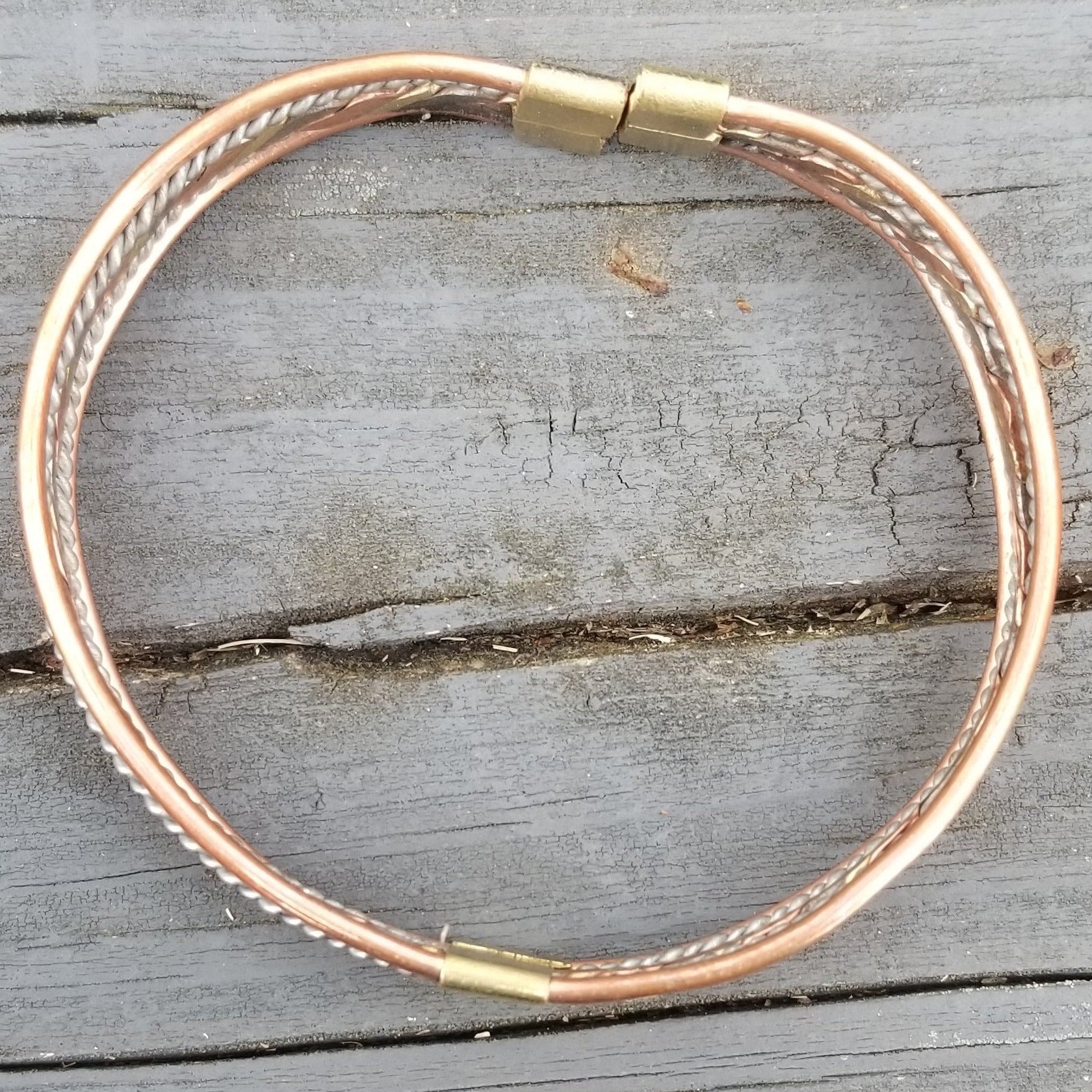 An image of Flattened twist combining different metallic tones. Shop Kamawe